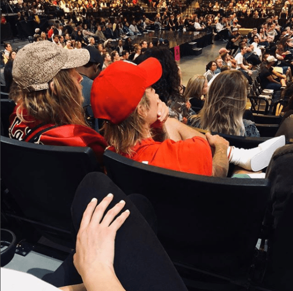 Bieber's friend Nathan Finochio took an Instagram snap of the pop star during a service at Hillsong Church, proving there's nowhere he won't sport his slippers.