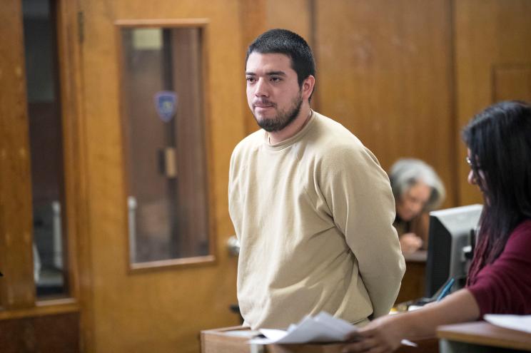 Roger Alvarado stands in front of a judge in Manhattan Criminal Court.