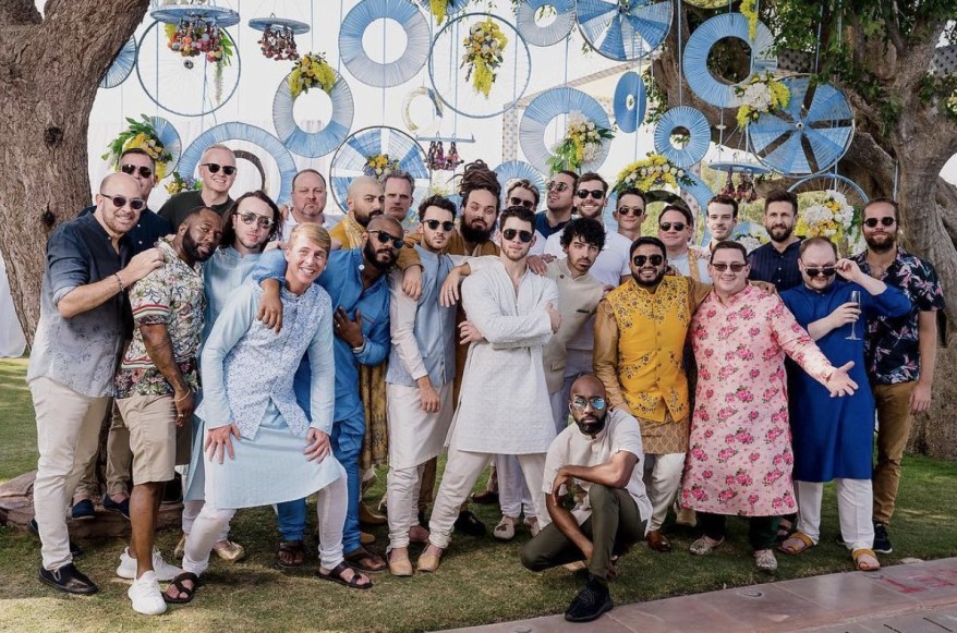 He posed with the rest of Nick Jonas' wedding party in Mumbai.