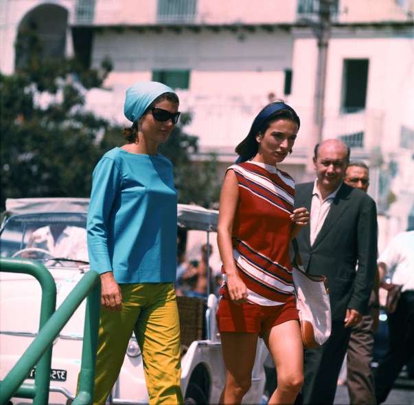 Jackie Kennedy is shown at the Pier of Amalfi, en route to Conca dei Marini beach via motorboat and then back from Amalfi to Ravello Villa.