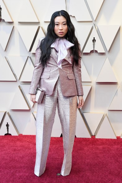 Awkwafina wore a metallic lavender Dsquared2 suit with an exaggerated pussy-bow blouse.