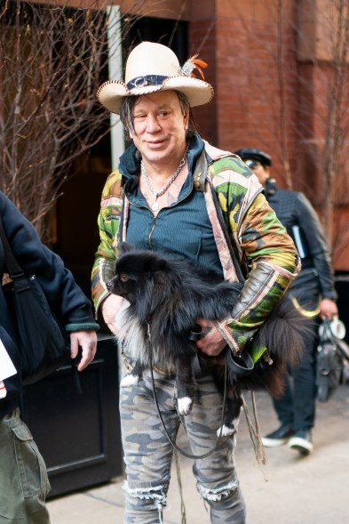 Mickey Rourke totes around his dog while out in New York.