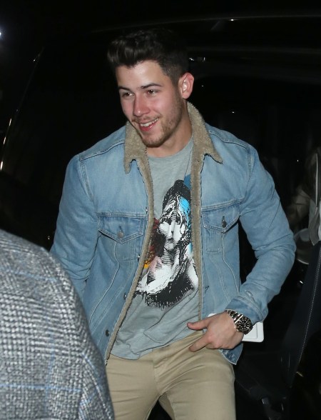 Nick Jonas shows his love for musicals with a Les Miserables shirt in London.