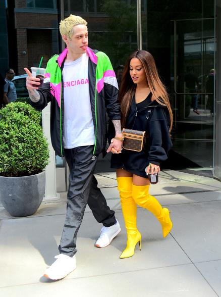 While Grande ditched her signature ponytail for a stroll with Davidson, the comedian showed off his grown-out blond hair and Umbro tracksuit with a Balenciaga T-shirt.