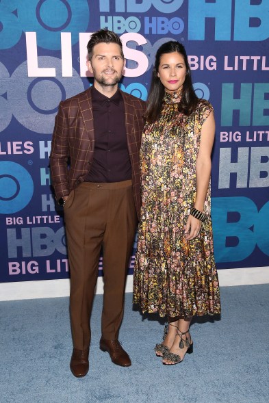 Adam Scott chose shades of brown for his look, including a windowpane blazer and pleated pants. He posed with wife Naomi Scott.