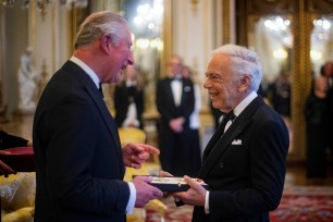 Prince Charles presents Ralph Lauren with his honorary Knight Commander of the Order of the British Empire for Services to Fashion.