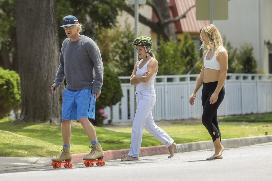 Owen Wilson learns to skate with the help of two blonde women in Santa Monica, California.