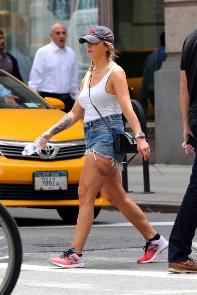 Miranda Lambert wears short shorts and shows off a new forearm tattoo while sporting a huge bruised spot on her left leg in New York.