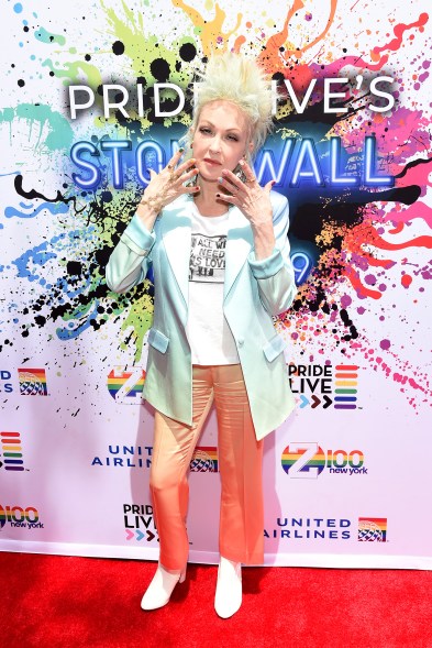 Cyndi Lauper showed her true colors with an ombré pantsuit and multi-hued manicure.