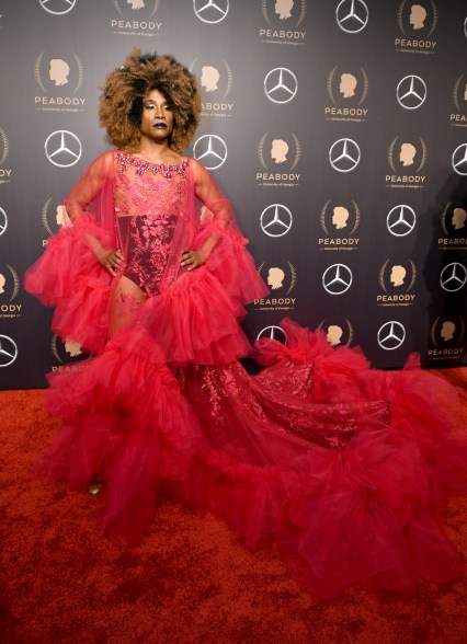 Wearing a lacy see-through number by Celestino Couture at the Peabody Awards.