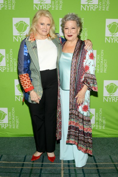 Candice Bergen and Bette Midler pose at the New York Restoration Project Spring Picnic at the New York Botanical Garden.