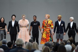 Lang Lang, Cara Delevingne, Lil Buck, Robert Carsen, Tilda Swinton, Pharell Williams and Helen Mirren pose on stage during the Karl Lagerfeld Homage in Paris.