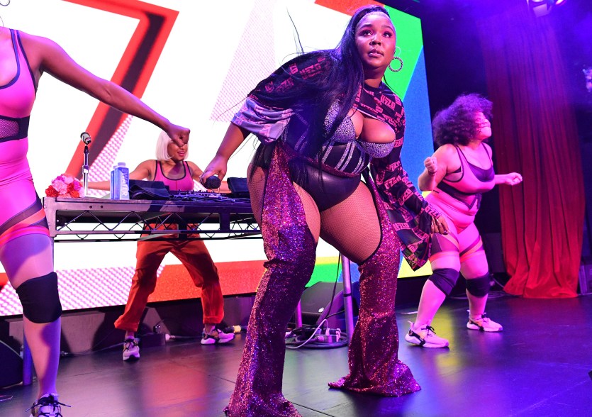 Lizzo saddled up in sparkling chaps and a matching bustier to perform at American Express' Pride kickoff event.