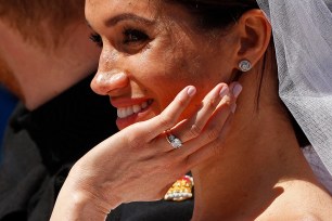 Meghan Markle shows off her original engagement ring at her wedding to Prince Harry on May 19, 2018.