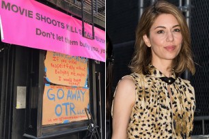The sign outside the Julia Testa Flower store protesting Sofia Coppola's new movie shooting in front of the store.