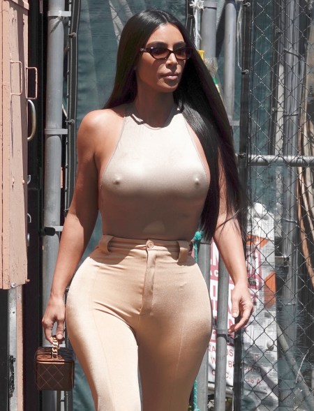 Kim Kardashian leaves little to the imagination with a tight fitting top and no bra while leaving a restaurant in Los Angeles.