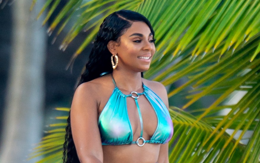 Ashanti sports metallic chaps and snakeskin bikinis for PrettyLittleThing