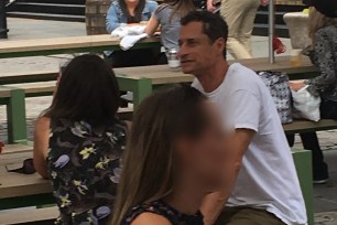 Anthony Weiner (right) with a mystery woman