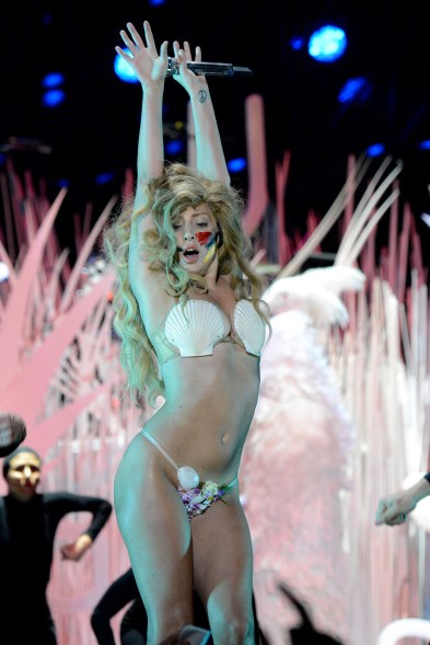 Mother Monster as mermaid? At the 2013 awards, Lady Gaga stripped down to this seashell thong bikini while performing “Applause.”