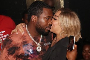 Wendy Williams awkwardly kisses Meek Mill