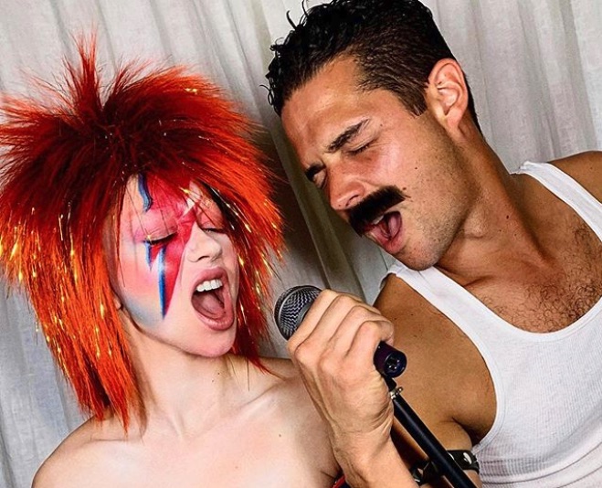 Sarah Hyland as David Bowie and Wells Adams as Freddie Mercury