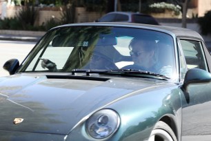 Felicity Huffman and William H. Macy in his Porsche