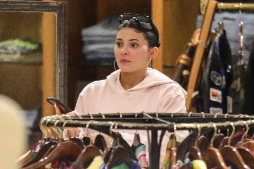 Kylie Jenner goes out with minimal makeup while out shopping at the vintage clothing store What Goes Around Comes Around in Beverly Hills.