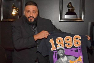 DJ Khaled holding up his Kobe Bryant t-shirt