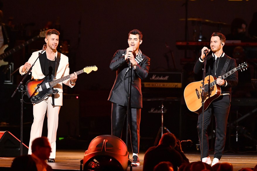 The Jonas Brothers perform on stage at MusiCares.