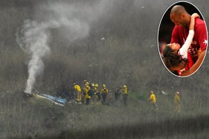 Firefighters work the scene of a helicopter crash that killed former Lakers player Kobe Bryant and his daughter Gigi