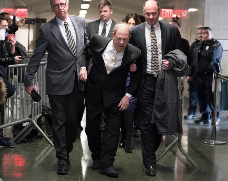 Harvey Weinstein, center, is helped by Dr. William Currao, left, and Juda Engelmayer as he arrives at Manhattan Court, Thursday, Jan. 23, 2020.