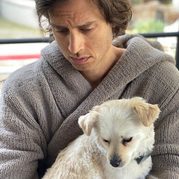 Gwyneth Paltrow snaps a photo of Brad Falchuk and his dog doing some morning reading.