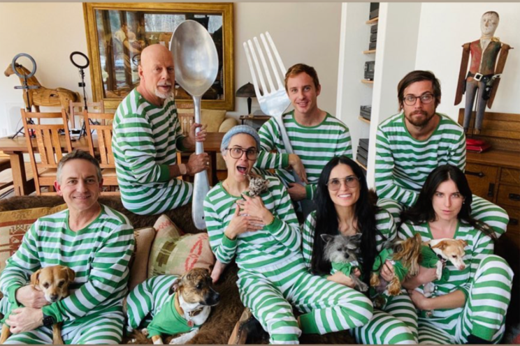 Demi Moore and Bruce Willis pose with daughters Tallulah and Scout in matching green striped pajamas from Leveret.