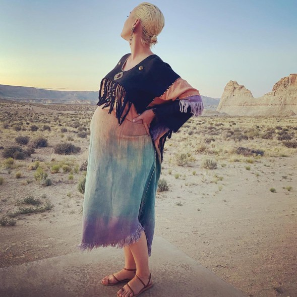 Perry posed in the desert on June 17, matching the sunset in a colorful ombré caftan and Ancient Greek sandals.