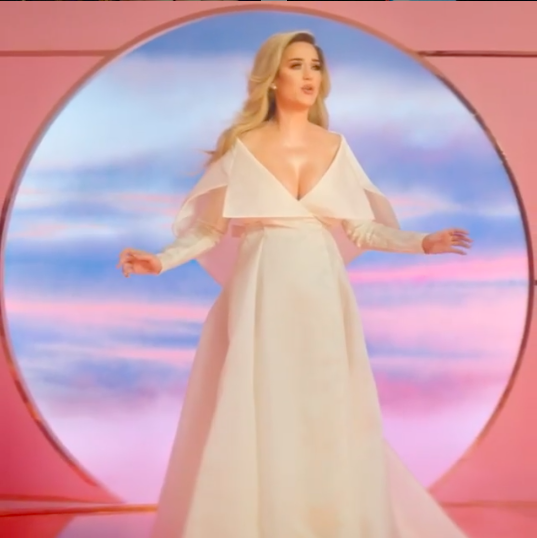 Perry announced she was pregnant with a splash, cradling her stomach in an Alexis Mabille wedding dress in her music video for "Never Worn White." The song's sweet lyrics refer to the "full family tree" she hopes to have with Bloom in 60 years.