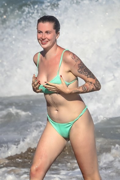 Ireland Baldwin goes for a dip splash while enjoying a beach day