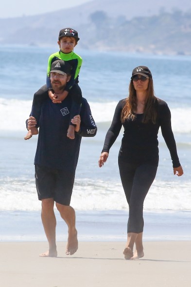 Christian Bale totes his son Joseph, 5, while on a family stroll with wife Sibi Blažić in Malibu.