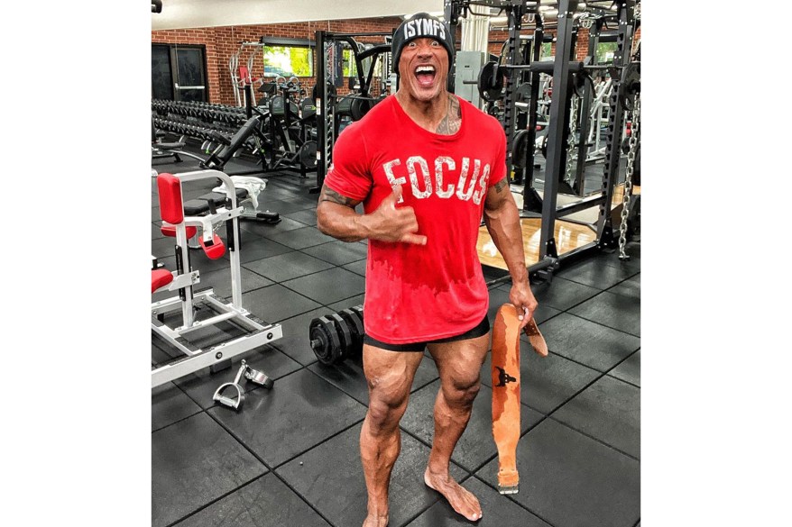 Dwayne "The Rock" Johnson flashes his gams in the gym on leg day.