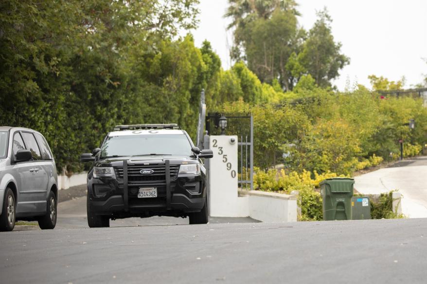 FBI units are seen leaving Jake Paul's home.