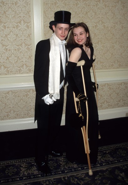 With his then-wife Rachel Miner in 1997