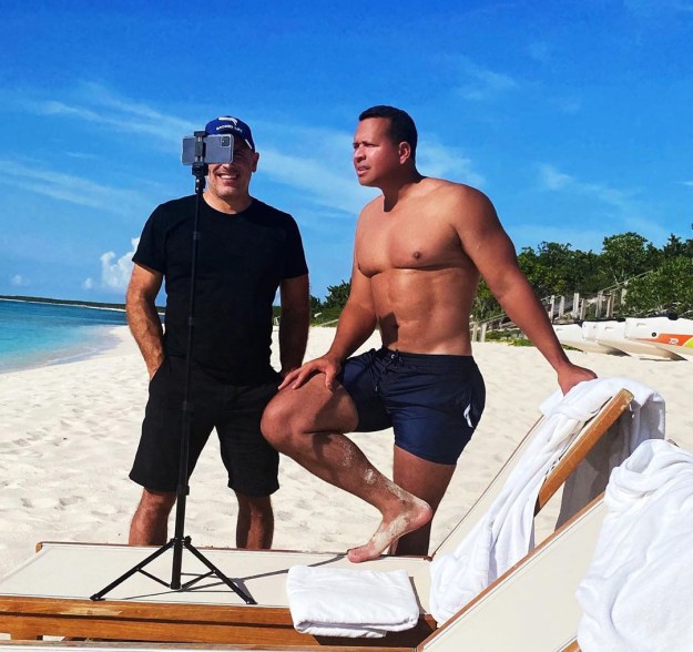 Alex Rodriguez shows off his impressive physique before hopping on a Zoom meeting on the beach.