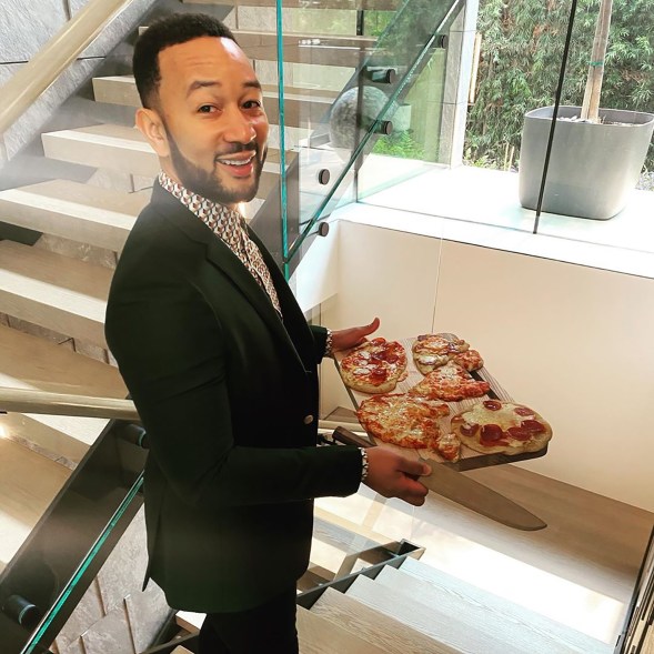 John Legend serves his kids pizza as a homeschool treat in Beverly Hills, Calif.