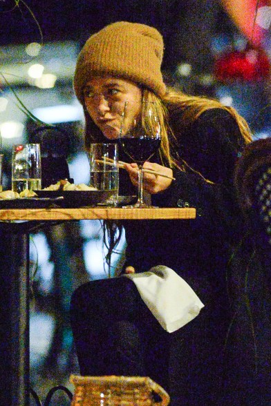 Mary-Kate Olsen grabs dinner with a friend al fresco in New York.