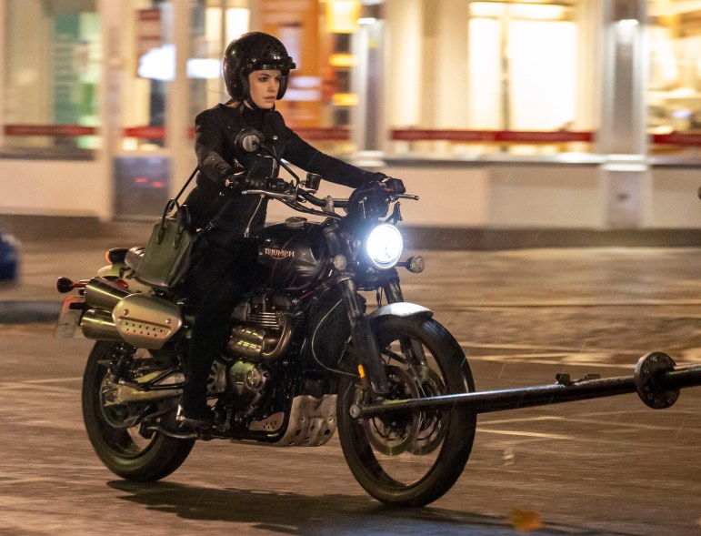 Anne Hathaway rides a motorcycle while filming her new movie, "Lockdown," in London.