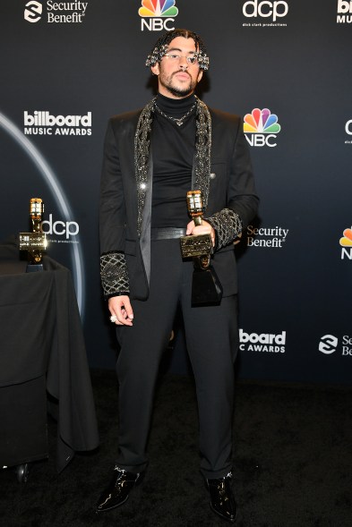 Performer Bad Bunny accepted his Top Latin Artist and Top Latin Album awards in a crystal-studded suit and matching turtleneck.