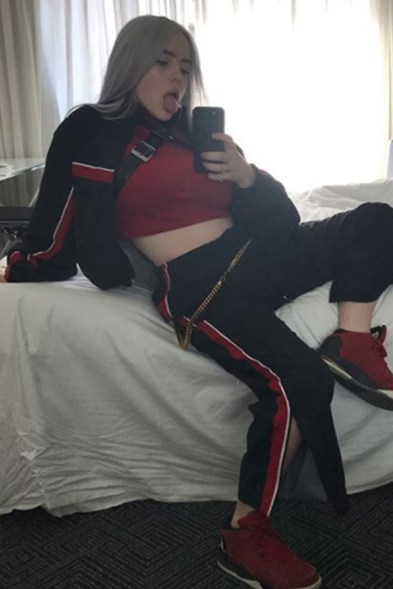 While in Australia, the singer struck a pose wearing track pants and a crop top.