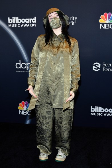 Billie Eilish took home Top New Artist, Top Female Artist and Top Billboard 200 Album in a green Gucci look that included a face mask and bucket hat.