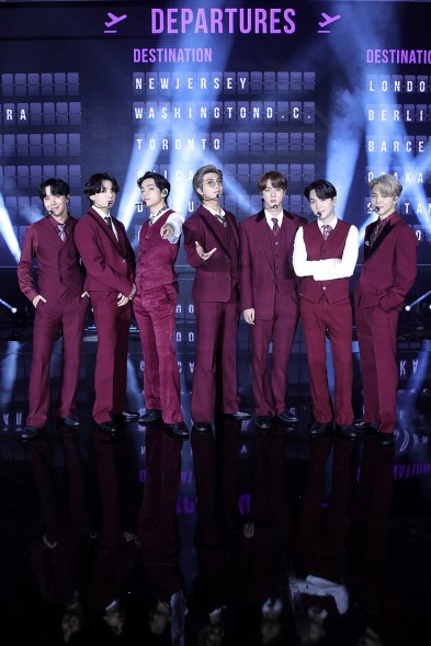 Performers and Top Social Artist winners BTS coordinated in plum suiting.