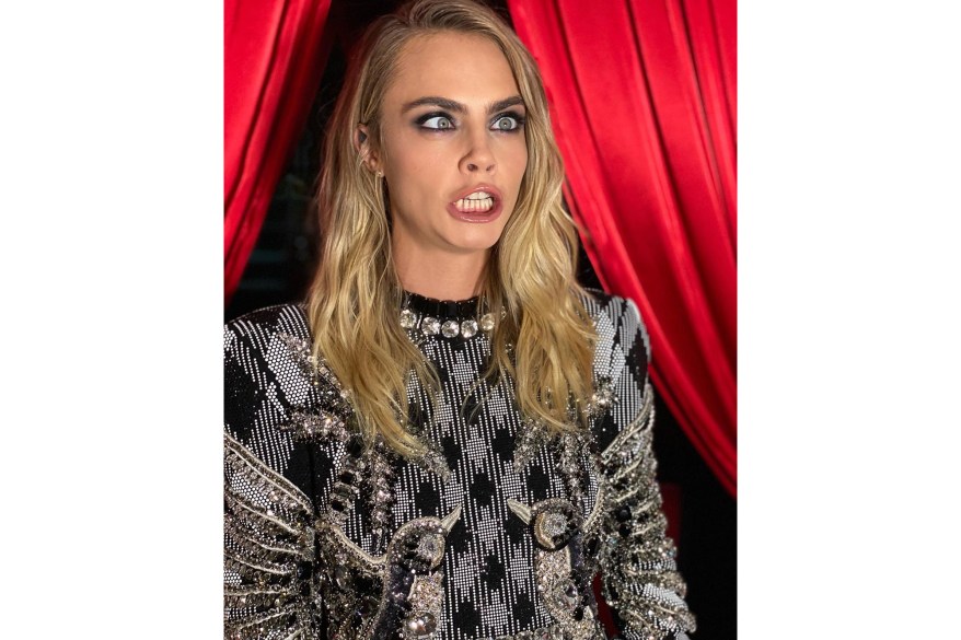 Cara Delevingne gets silly during a photo shoot for luxury brand Balmain.