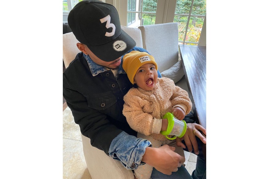 Chance the Rapper cuddles his 1-year-old daughter, Marli.